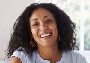 Woman-Laughing-in-Baby-Blue-Blouse