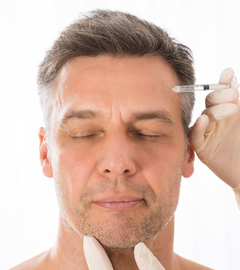 handsome man getting facial injections