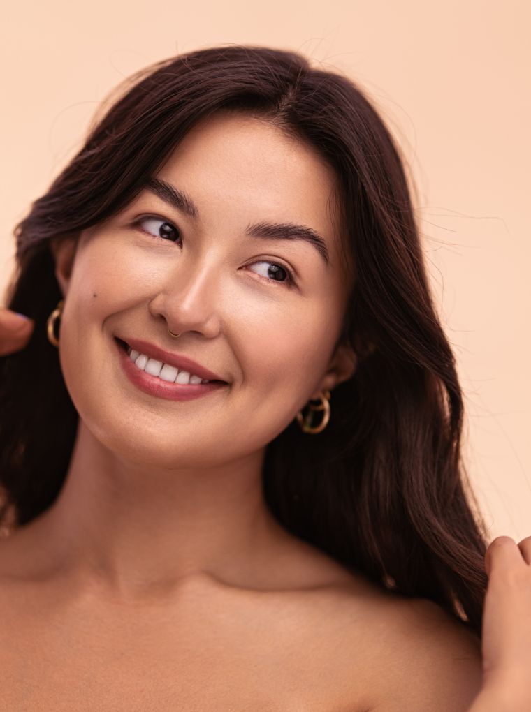 Smiling woman with her nose pierced