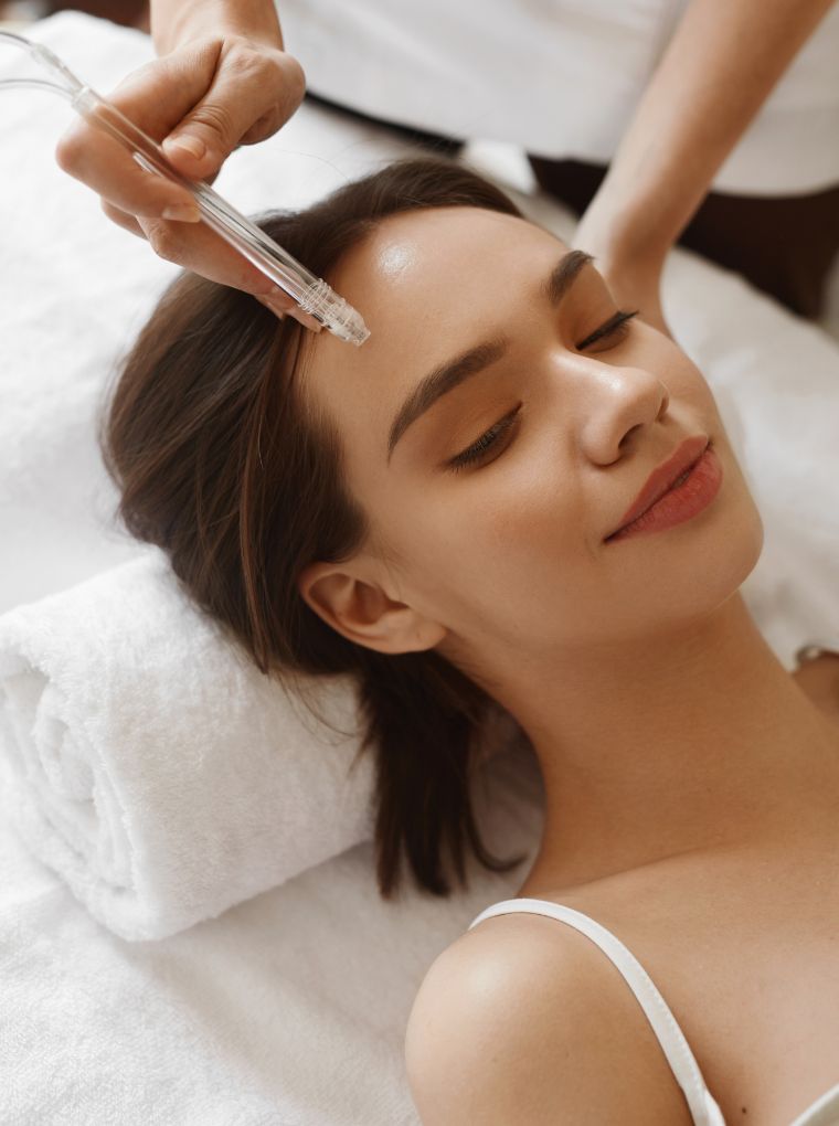 young woman getting a facial procedure done